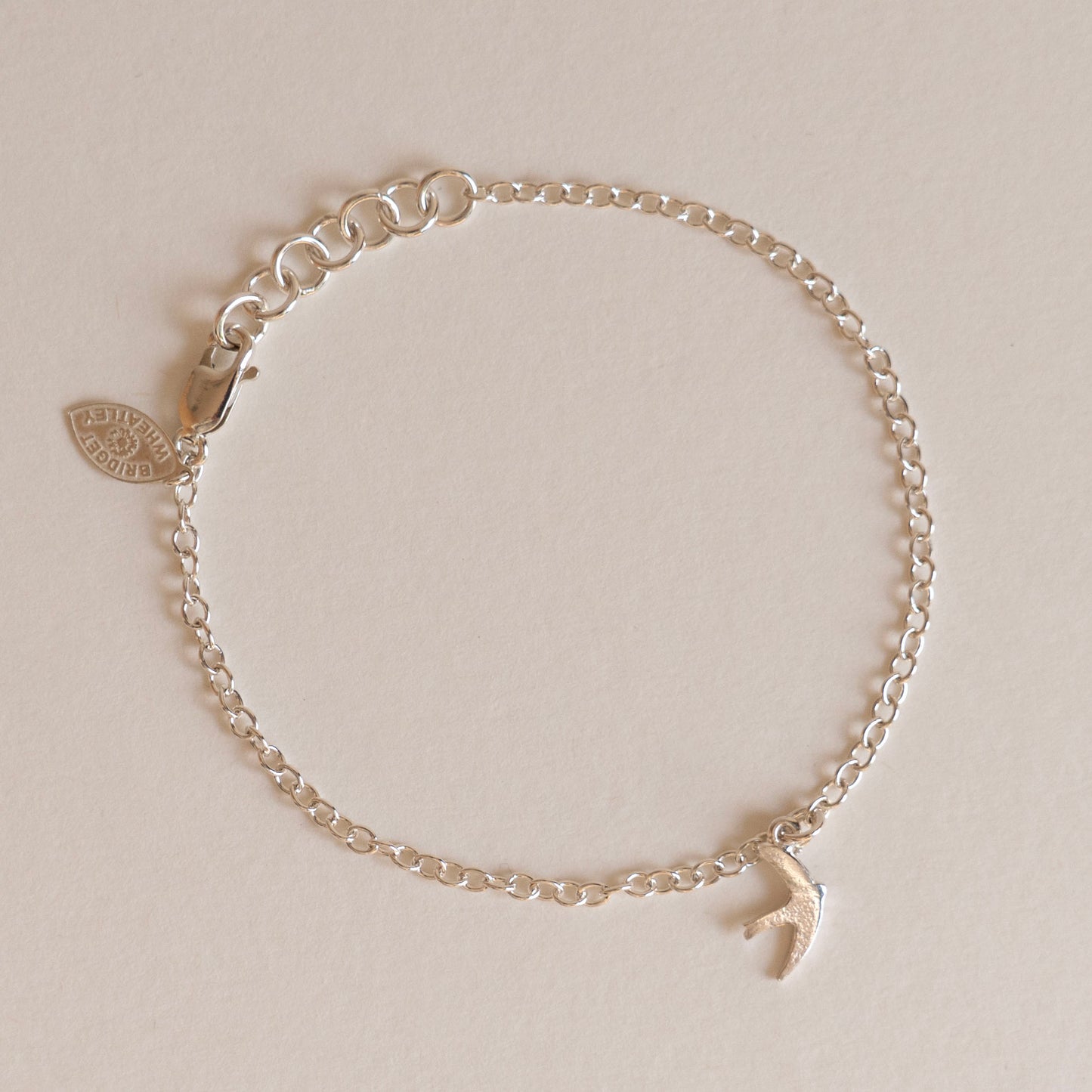Silver swift charm bracelet