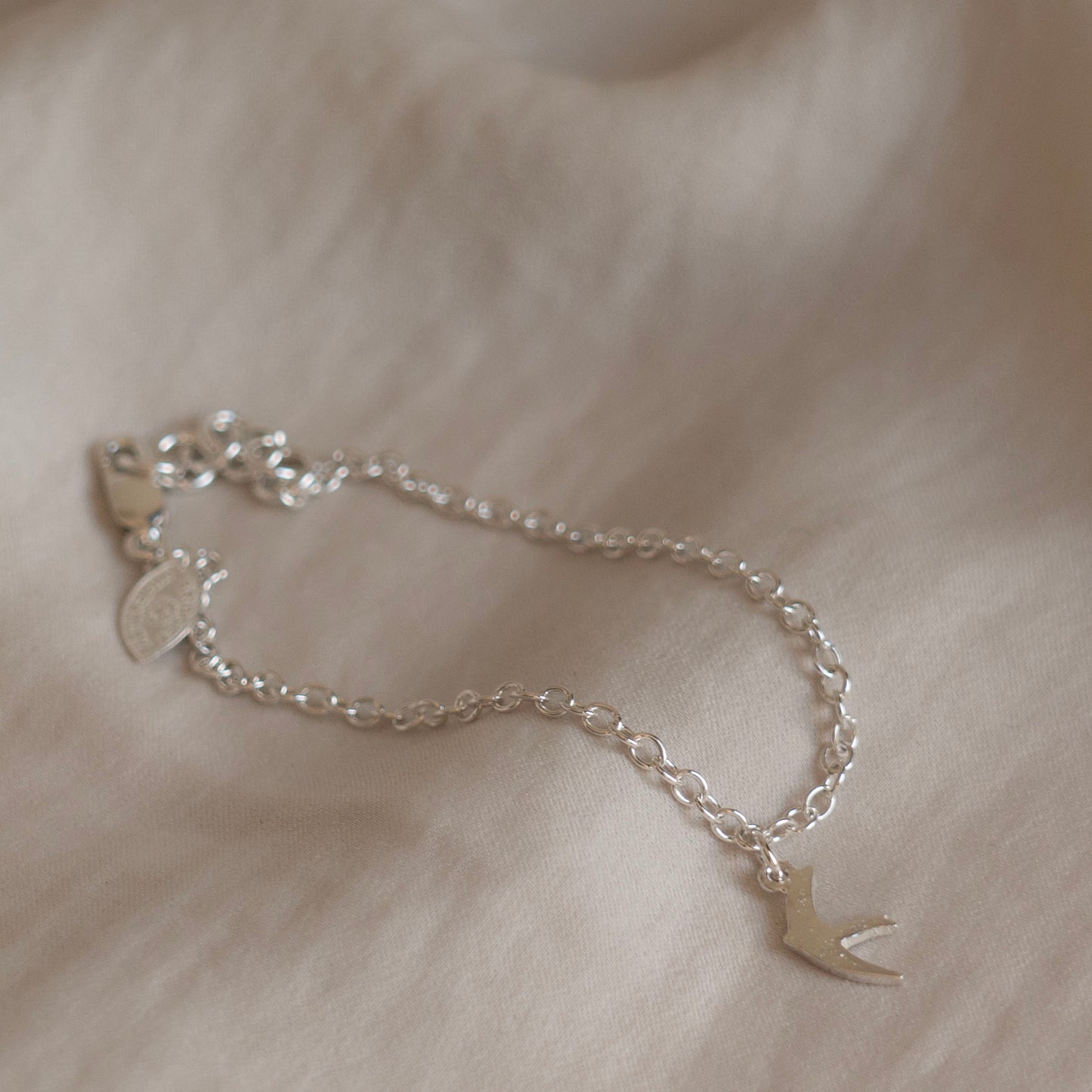 Silver swift charm bracelet