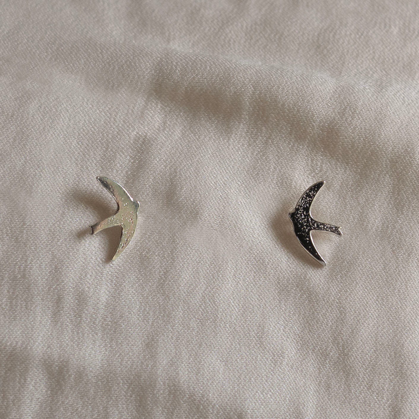 Silver swift stud earrings