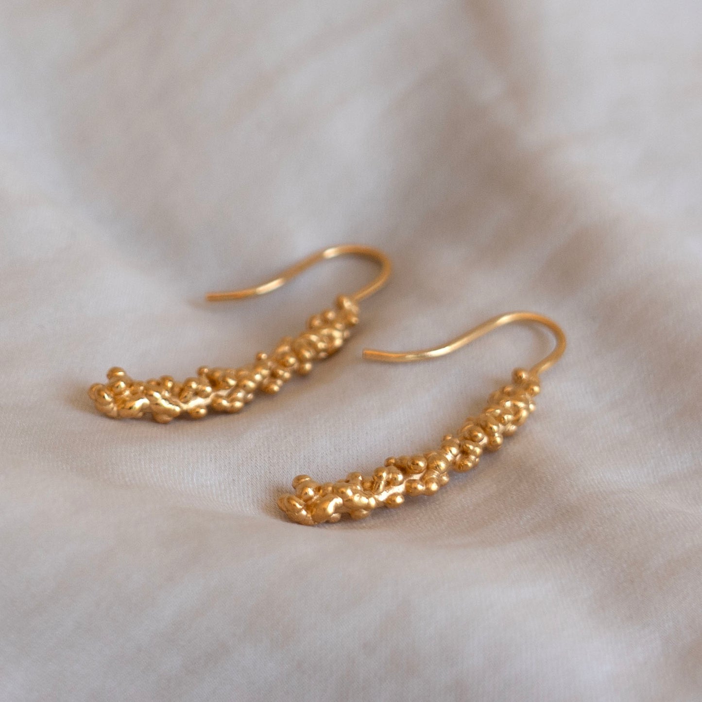 Gold millet stick drop earrings