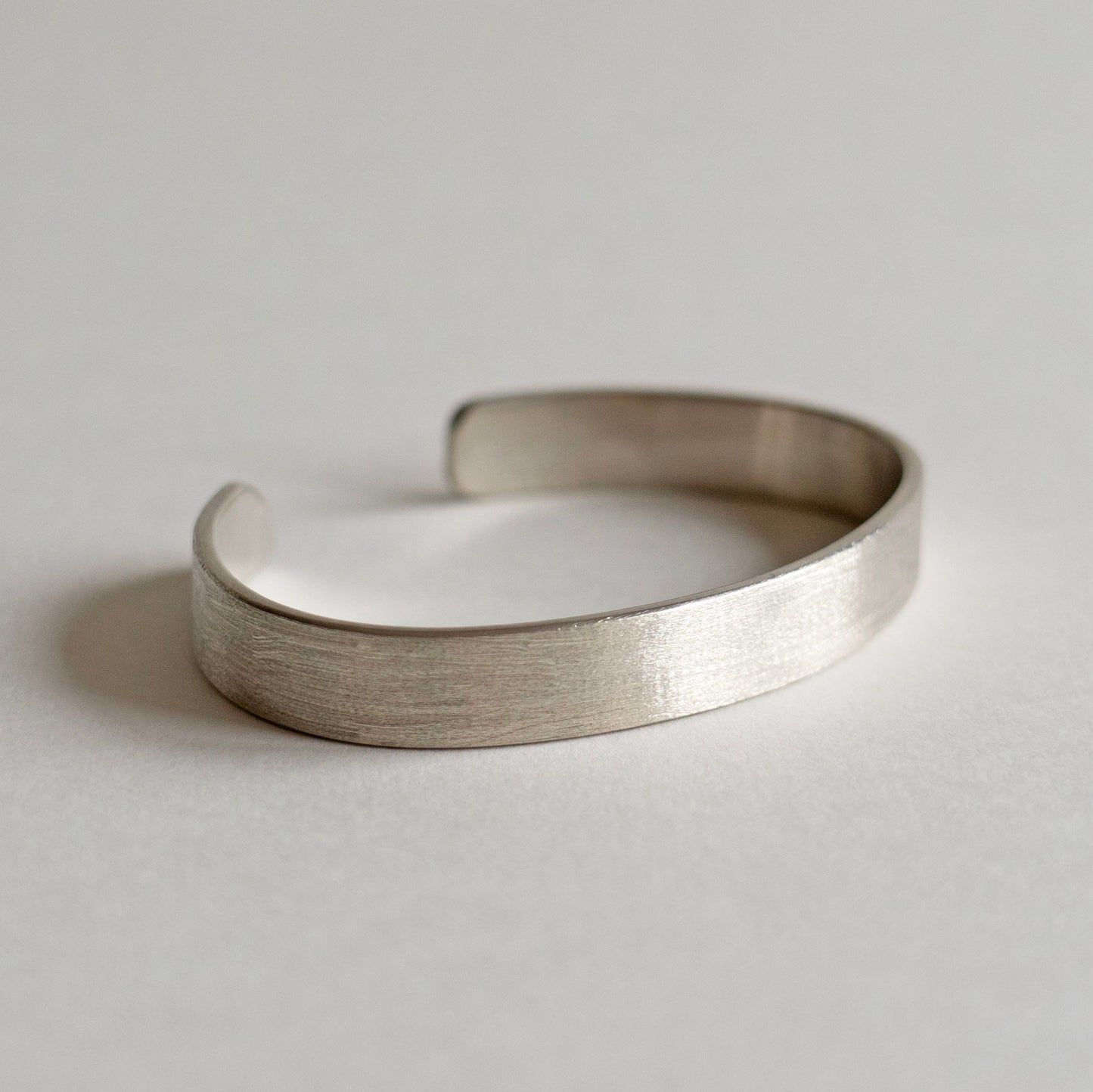 Wide brushed solid silver cuff