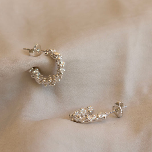 Silver millet seed hoop earrings
